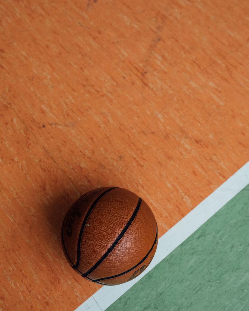 Close up of sports equipment on a clean floor.