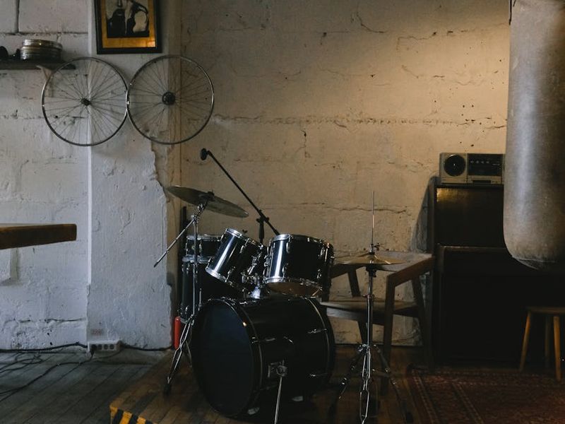 Person doing dynamic exercises in a sunlit loft studio.
